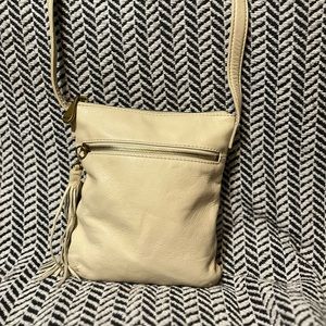 Cream colored Hobo the original crossbody purse